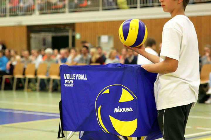 boy with a volleyball cart